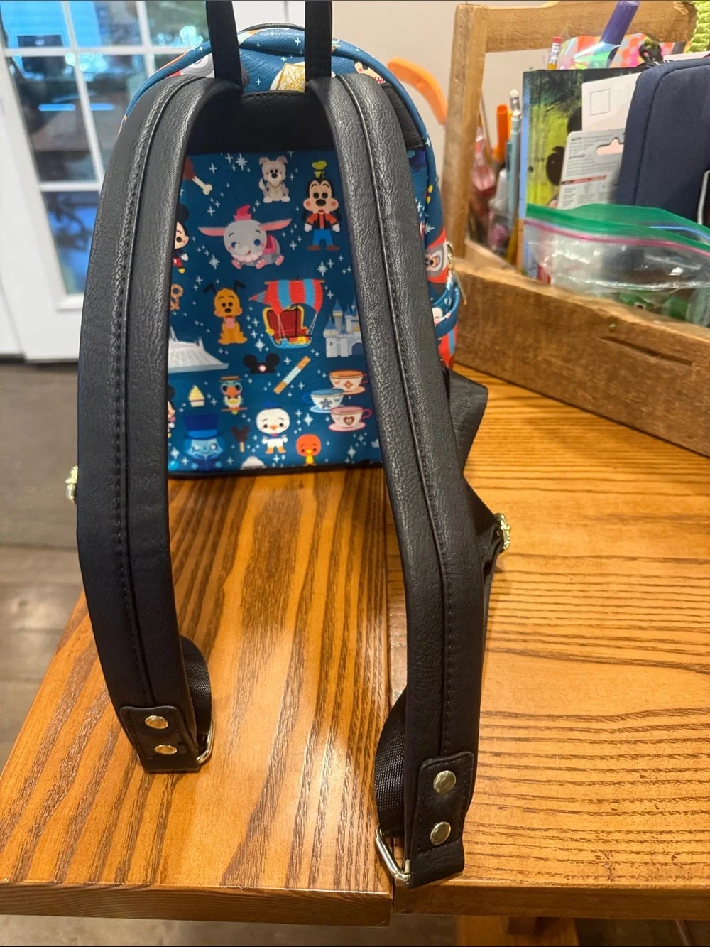 Loungefly Blue Mini Backpack with Colorful Theme Park Character Print